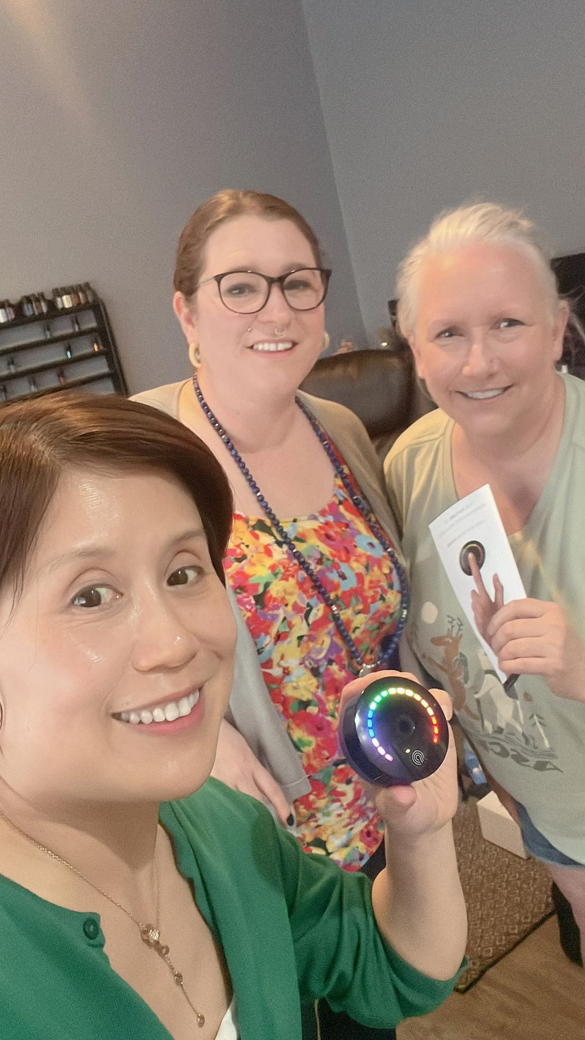 Three people smiling together during a visit